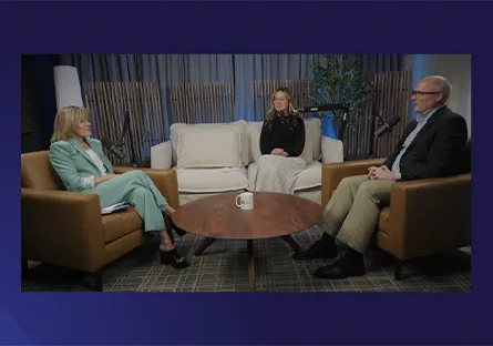From left to right, President Kate Smith, Lindsey Crosland, and Jared Taylor are seated in armchairs around a small round table during a podcast-style conversation in a studio setting with soft lighting and plants in the background.