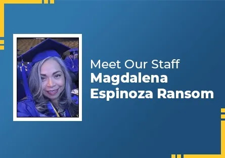 A woman wearing a blue graduation cap and gown smiles at the camera while seated among other graduates. The photo is framed on a blue graphic background with yellow corner accents and text that reads ‘Meet Our Staff – Magdalena Espinoza Ransom.