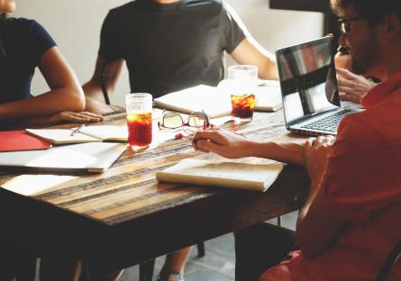 People at a pitch meeting in an office