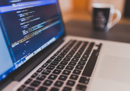Coding on an open laptop