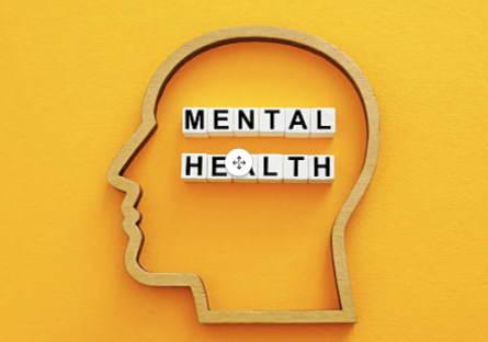 The outline of a head with the words MENTAL HEALTH spelled out in tiles