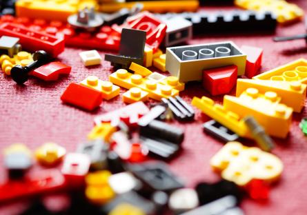 A pile of assorted Lego bricks on the floor