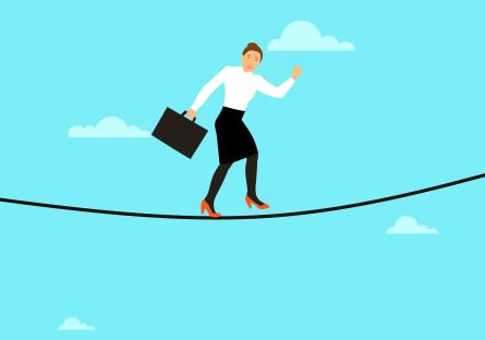 A professional woman walking on a tightrope while holding a briefcase