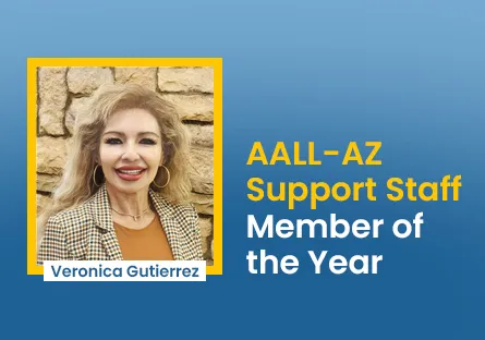 Veronica Gutierrez stands with fellow adult education professionals at the Arizona Department of Education Adult Education Institute in Phoenix. The group poses in front of an Adult Education Services backdrop.