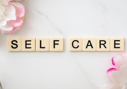 Word tiles that spell out Self Care