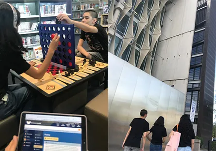 Dani Hernandez spends time with her children at the Phoenix Public Library, including playing a tabletop game together, walking through the library and using a laptop.