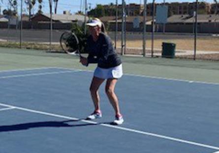 photo of Dr. Angela Felix playing tennis