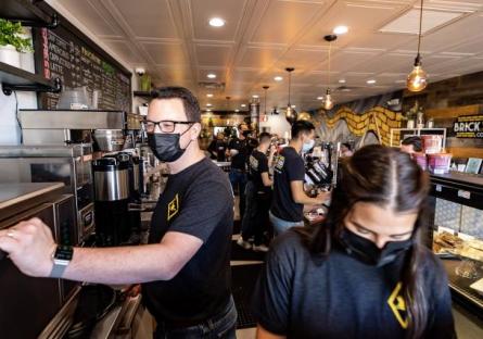 photo of the staff of Brick Road Coffee working behind the counter