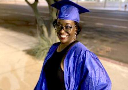 image of Tisha in her cap and gown at Commencement