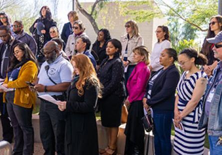 Rio employees and guests reciting a song during MLK Day event