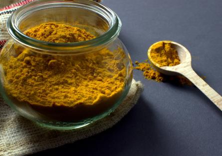 Turmeric powder in a mason jar