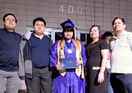 photo of the Nguyen family at Helen's college graduation