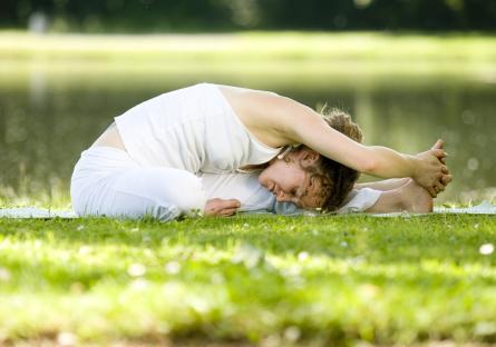 Woman doing yoga outdoors