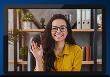 Student smiling in library