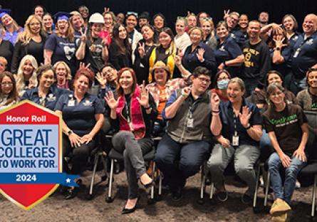 employee group photo with the Great Colleges Honor Roll logo