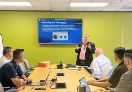 Rick Vaughn presents a semiconductor lesson to students