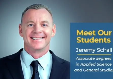 A smiling man in a suit and tie is featured against a gradient blue background. A graphic box on the right reads: Meet Our Students in bold yellow text, followed by Jeremy Schall and Associate degrees in Applied Science and General Studies in white text.