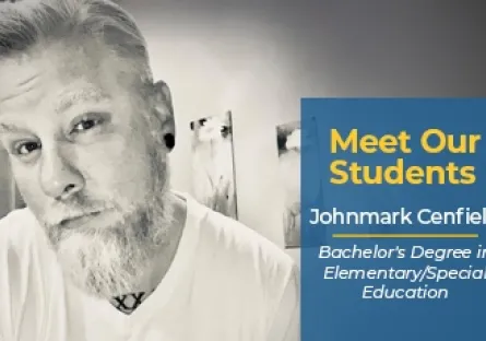 A black-and-white portrait of Johnmark Cenfield wearing a white T-shirt, with short light-colored hair, a beard, and earrings. A blue and yellow graphic overlay reads: Meet Our Students – Johnmark Cenfield, Bachelor’s Degree in Elementary/Special Education.