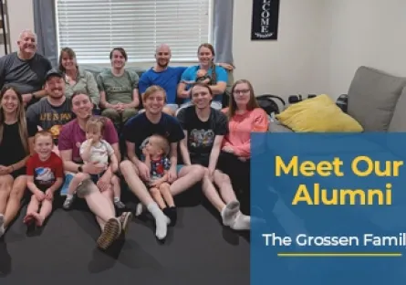 A large family group photo taken indoors, showing multiple adults, children, and a dog sitting together and smiling at the camera. On the right side, a blue text box reads: Meet Our Alumni – The Grossen Family.