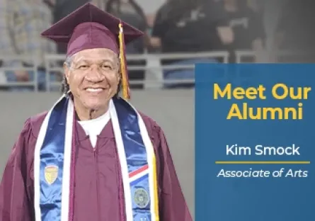 Kim Smock, a Rio Salado College graduate, smiles while wearing a maroon cap and gown with a white stole and several graduation medallions. Text beside the photo reads: “Meet Our Alumni – Kim Smock, Associate of Arts.” The image celebrates his academic achievement and Rio Salado College pride.