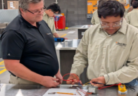 HVAC instructor works with students at the West-MEC Career Academy @ Agua Fria in Avondale, AZ.