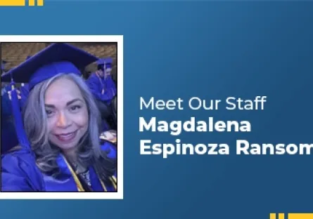 A woman wearing a blue graduation cap and gown smiles at the camera while seated among other graduates. The photo is framed on a blue graphic background with yellow corner accents and text that reads ‘Meet Our Staff – Magdalena Espinoza Ransom.