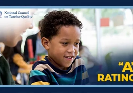 Young student engaged in a classroom activity with an adult nearby, with the National Council on Teacher Quality logo and text reading “A Rating.”