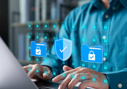Man typing on keyboard while security icons float overhead