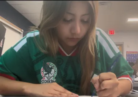 Allyson Hurtado Fernandez works on an assignment at her desk at Tempe High School as part of her day as a Dual Enrollment student.