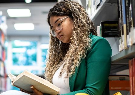 Young person reading a book