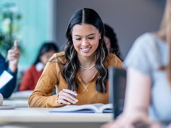 Female student with pen and paper