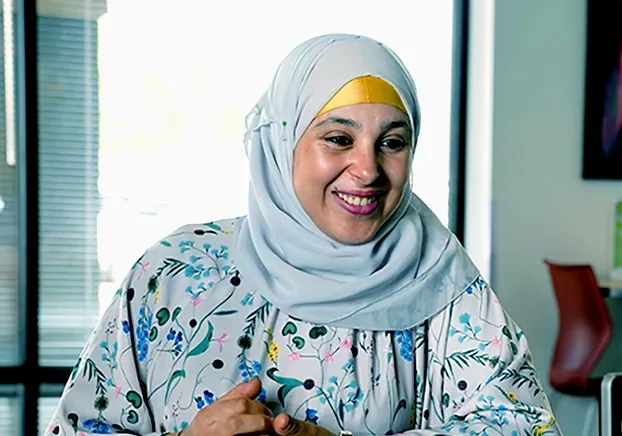 woman smiling and looking straight ahead