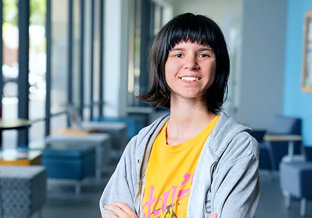 Woman smiling and looking straight ahead